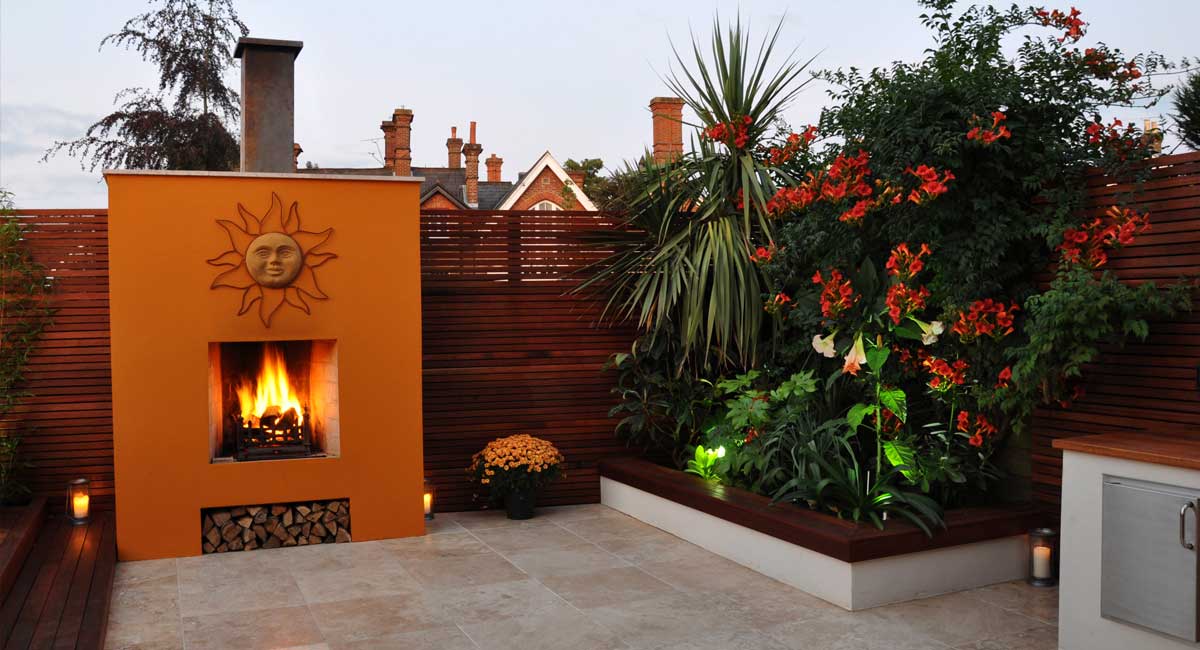 Outdoor fireplace and travertine paving